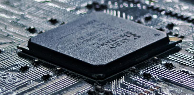 A black-and-white computer chip representing AI.